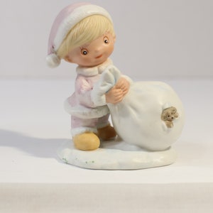Christmas Figurine Boy Carrying Gifts by Homco Interiors. Porcelain # 3613