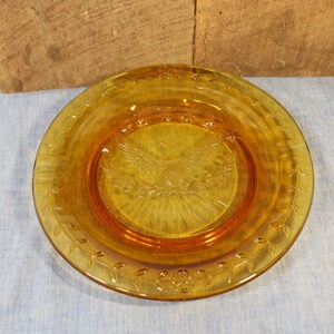 9 1/4" Ashtray with Bicentennial Eagle and Stars Gloriously Embossed in Amber Glass