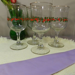 Libbey Glass Co. Wine Glass / Water Goblet with Beautiful Cut glass Stem, Gold Trim and Holly Berry, and Ribbon pattern.