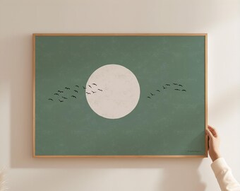 May include: A rectangular wall art print in a light wooden frame featuring a solid sage green background with a large, centered, off-white circular moon and a flock of small black birds flying across the center in a horizontal formation.