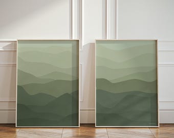 May include: Two vertical rectangular wall art prints featuring a layered landscape design. The artwork displays abstract rolling hills in varying shades of sage, olive, and forest green, creating a gradient effect from light to dark tones.