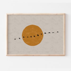 Horizontal art prints with beige / gray background, orange sun and flock of birds silhouette.