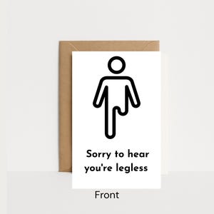 May include: A white greeting card with a black line drawing of a person with one leg. The text "Sorry to hear you're legless" is below the illustration. The card is in a brown envelope.