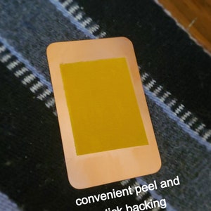 May include: A copper-colored sticker sheet with a yellow adhesive backing. The sheet has the text "convenient peel and stick backing" printed on the bottom.
