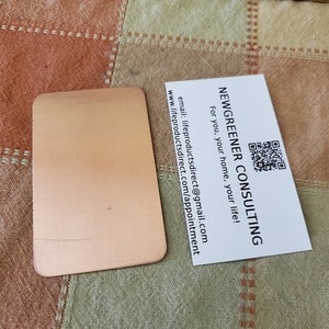 May include: A white business card with the text "NEWGREENER CONSULTING" and a QR code. The text below the company name reads "For you, your home, your life!" and includes contact information.
