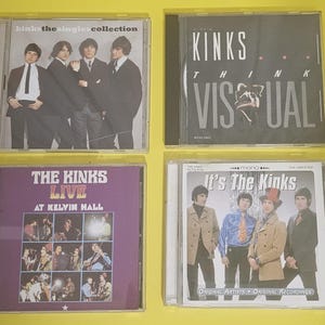 Op de afbeelding: Vier cd-hoezen met de band The Kinks. De hoezen zijn zwart met een doorzichtige plastic voorkant. De titels van de albums zijn "The Kinks Singles Collection", "Kinks Think Visual", "The Kinks Live at Kelvin Hall" en "It's The Kinks".