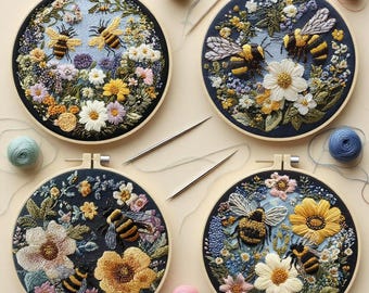 May include: Four embroidered hoops featuring bees and flowers. Each hoop has a dark blue background with colorful floral designs and detailed bee embroidery. The hoops are surrounded by wooden frames, with spools of thread and needles.