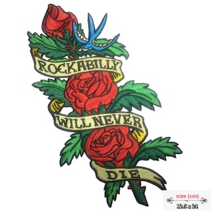 May include: Embroidered iron-on patch featuring three red roses with green leaves and a yellow banner that reads "Rockabilly Will Never Die". The patch measures 12.5 cm by 24 cm.