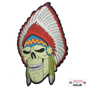 May include: Embroidered iron-on patch featuring a green skull wearing a colorful Native American headdress with red, white, blue, and yellow feathers. The patch measures 17.5 inches by 27 inches.