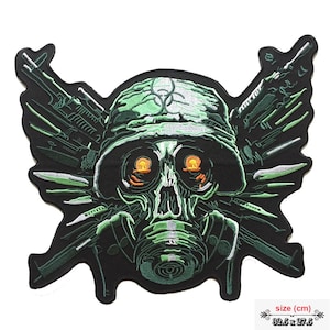 May include: Embroidered patch featuring a skull wearing a green helmet and gas mask. The skull has glowing orange eyes and is surrounded by green and black weaponry. The patch measures 32.5 x 27.5 cm.