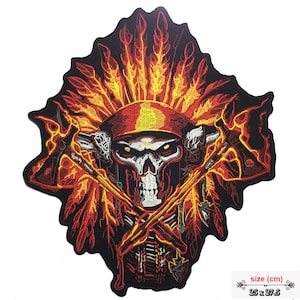 May include: Embroidered iron-on patch featuring a skull wearing a headdress with red, orange, and yellow flames. The skull is holding two crossed tomahawks. The patch is 25 x 27.5 cm.