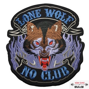 May include: Embroidered patch featuring a wolf's head at the centre, surrounded by flames and the text "Lone Wolf No Club". The wolf has red eyes and a fierce expression. The patch is black with blue and silver accents. Size: 27.5 x 25 cm.
