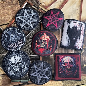 May include: Nine embroidered patches with various designs, including skulls, pentagrams, and a figure with a scythe. The patches are on a wooden surface.