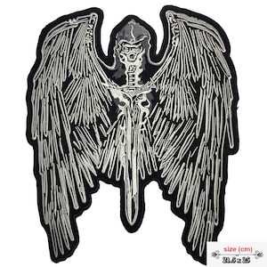 May include: Black and white embroidered iron-on patch of a skeletal angel with wings spread wide, holding a sword. The patch measures 21.5 cm by 25 cm.