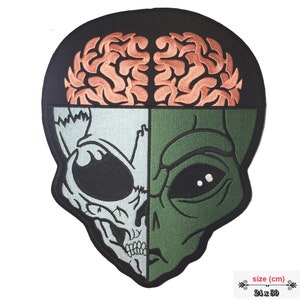May include: Embroidered patch featuring a green alien head with a skull on the left side. The alien's brain is visible above the head, with a pink and black design. The patch is 24 inches by 30 inches.