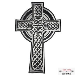 May include: A silver and black embroidered Celtic cross patch with intricate knotwork designs. The patch measures 22.5 cm by 35.5 cm.