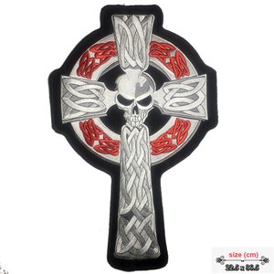 May include: A silver and red embroidered patch of a Celtic cross with a skull in the center. The cross is surrounded by a circle of red Celtic knots. The patch is 22.5 inches by 36.5 inches.