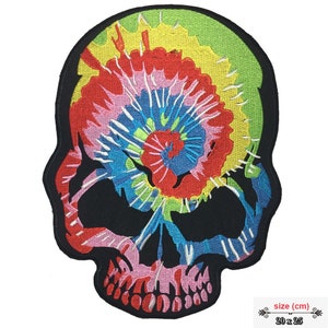 May include: A tie-dye skull patch with a colourful swirl design. The patch is 20 cm by 25 cm.