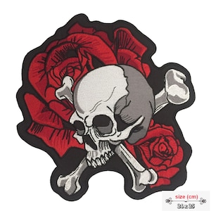 May include: Embroidered patch featuring a skull with crossed bones, set against a backdrop of red roses. The patch has a black border. The size is 24 x 25 cm.