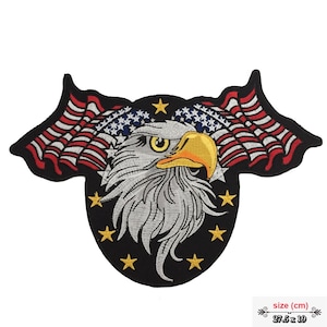 May include: Embroidered patch featuring a bald eagle with its wings spread, holding an American flag in its talons. The eagle is surrounded by a circle of stars on a black background. The patch measures 27.5 inches by 19 inches.