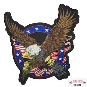 May include: Embroidered patch featuring a detailed bald eagle with outstretched wings, set against a black background. The design incorporates elements of the American flag, including red and white stripes and blue with white stars. The patch measures 25 x 25 cm.
