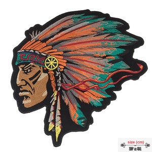 May include: Embroidered iron-on patch of a Native American chief wearing a headdress with feathers in shades of orange, green, and gray. The patch measures 27 x 31 cm.