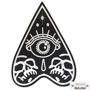 May include: Black and white embroidered patch in the shape of a triangle with a single eye and two skulls. The patch is 22.5 inches by 30.5 inches.