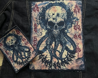 May include: A black denim jacket with two embroidered patches featuring a skull with tentacles. The patches are in a vintage style with a distressed background.
