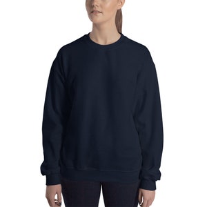 May include: A navy blue sweatshirt with a crew neck and long sleeves.