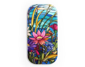 May include: A stained glass style illustration of a colorful floral arrangement with pink, blue, yellow, and white flowers. The background is a blue and white wavy pattern, reminiscent of water.
