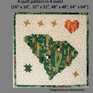 May include: A quilt pattern for South Carolina in four sizes: 16 inches by 16 inches, 32 inches by 32 inches, 48 inches by 48 inches, and 64 inches by 64 inches. The quilt features a green and orange patchwork design of the state of South Carolina, surrounded by a white background with a heart and stars.