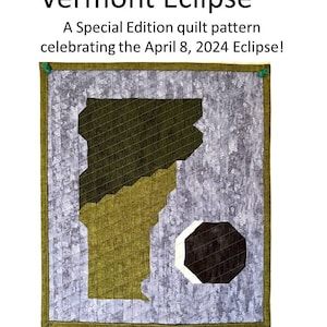 May include: A quilt pattern featuring a green outline of the state of Vermont with a black and white eclipse in the lower right corner. The quilt is 13 inches by 15 inches and is titled "Vermont Eclipse". The text "A Special Edition quilt pattern celebrating the April 8, 2024 Eclipse!" is above the quilt. The text "Designed by Karen Abrahamovich" is below the quilt.
