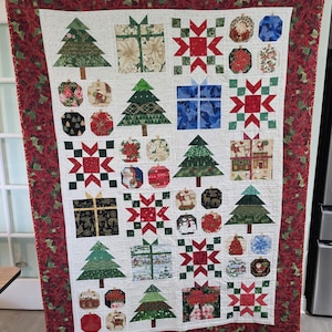 Handmade Christmas Things throw quilt, 52 x 72 inches.  It is a  scrappy quilt with all Christmas fabric in it.