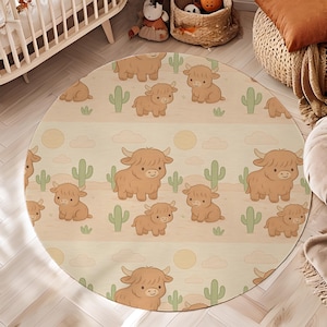 May include: Round area rug featuring a repeating pattern of cartoon Highland cows, cacti, and suns on a beige background. The rug is designed for a nursery or children's room, with a soft, inviting aesthetic. The rug's diameter is approximately 60 inches.