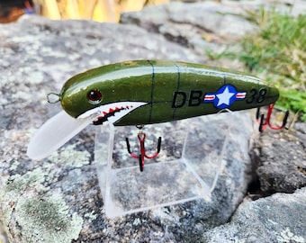 fighter jet fishing lure Bomber Certified Depth A combination vinyl and feather skirt seals the deal Bomber Certified Depth Hot Pink