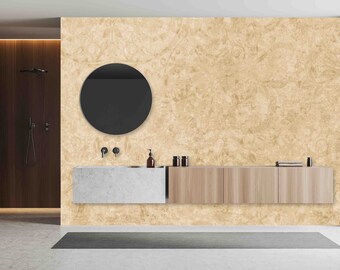 May include: A modern bathroom with a beige textured wall, a round mirror, a white countertop sink, and wooden cabinets.