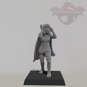 May include: A grey painted miniature figurine of a female character wearing a hooded cloak and a short skirt. She is standing on a black base.