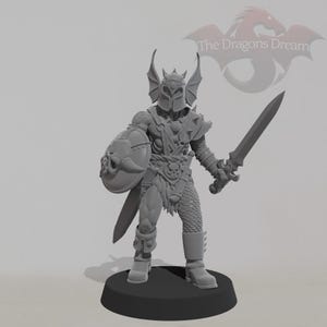 May include: A gray figurine of a warrior in full armor, holding a sword and shield. The warrior has a helmet with wing-like protrusions and is standing on a black base. The Dragons Dream logo is in the background.