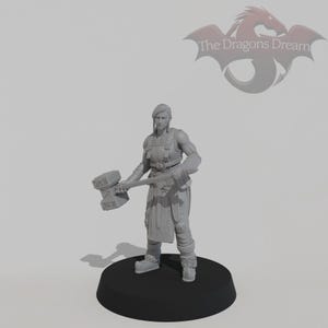 May include: A gray unpainted miniature figure of a warrior standing on a black circular base. The figure wears a tunic with a belt and fur-trimmed boots, holding a large rectangular hammer. The text The Dragons Dream is visible in the corner.