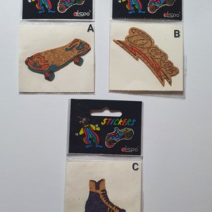 May include: Three vintage stickers on clear backing. The stickers feature a skateboard, the word "Dance" with a lightning bolt, and an ice skate. Each sticker is packaged with a black header card with a clown and race car graphic.