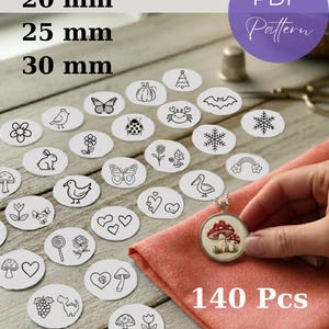 May include: A collection of printable hand embroidery patterns featuring 140 pieces with various black and white line art designs including flowers, animals, and seasonal icons. The text reads Pendant Sizes 20 mm, 25 mm, 30 mm, PDF Pattern, and 140 Pcs.