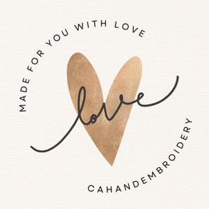 A square logo for a business called "CAHANDEMBROIDERY" is centered against a light-textured paper background.

The primary element is a large heart shape with a warm, metallic gold foil texture. An elegant, dark charcoal cursive script spelling "love" is intricately layered over the gold heart, following its curves.
