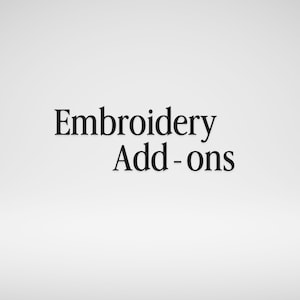 May include: The image displays the text "Embroidery Add-ons" in a black, serif font against a white background. The text is centered and takes up a significant portion of the frame.