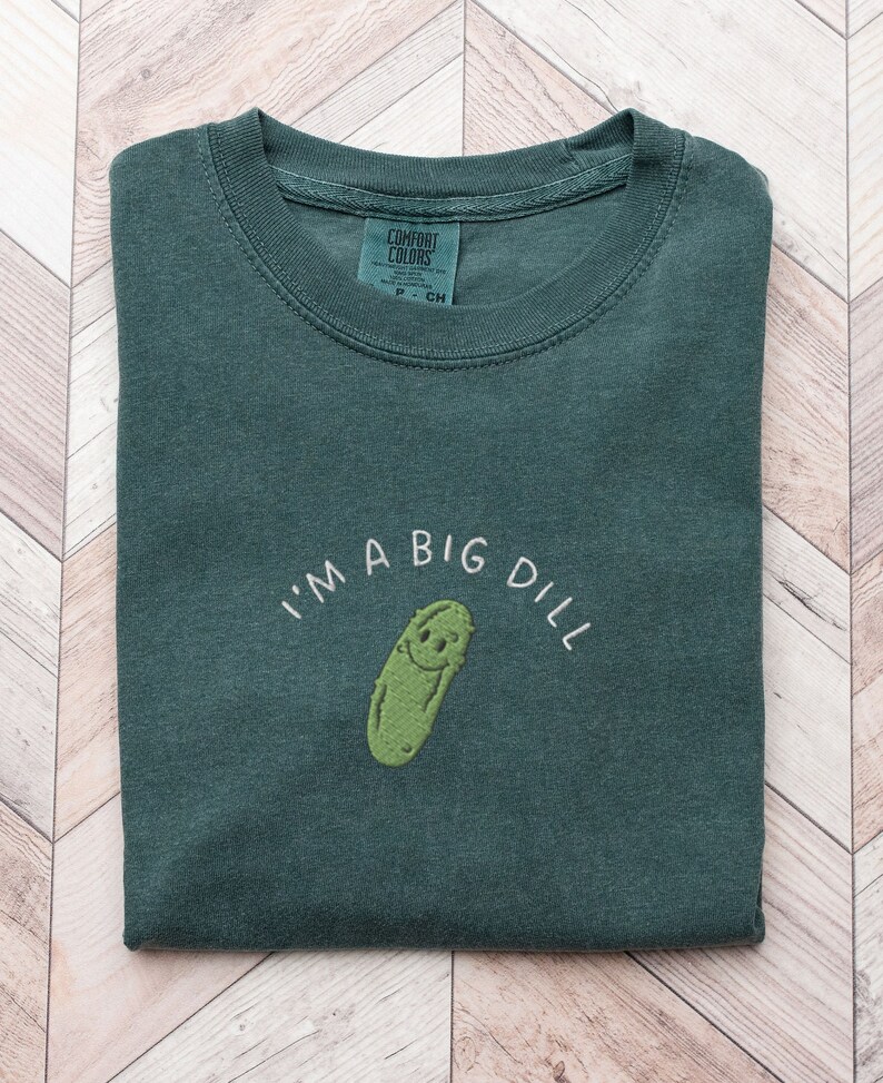 Cute Embroidered Pickle Shirt in Blue Spruce which is a dark green color, Comfort Colors brand, says "I'm a big dill" in capital letters
