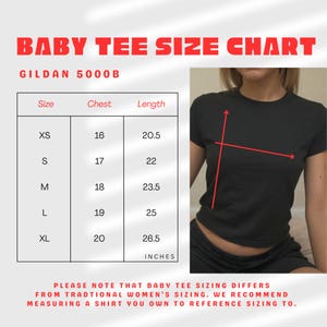 May include: A black baby tee size chart with measurements in inches. The chart includes sizes XS to XL, chest measurements from 16 to 20 inches, and lengths from 20.5 to 26.5 inches. The text "BABY TEE SIZE CHART" is at the top.