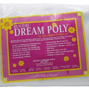 May include: White quilting batting in a pink and yellow package. The package says "Quilters Dream Poly" and "You Won't Believe It's Polyever!" The package also lists the different sizes available: Craft, Crib, Throw, Twin, Double, Queen, Super Queen, and King.