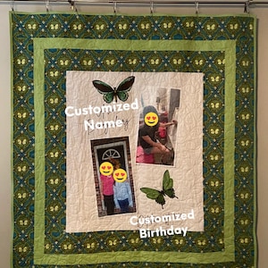 May include: A green and blue quilt with a butterfly design. The quilt has a white centre with two photos and the text "Customized Name" and "Customized Birthday".