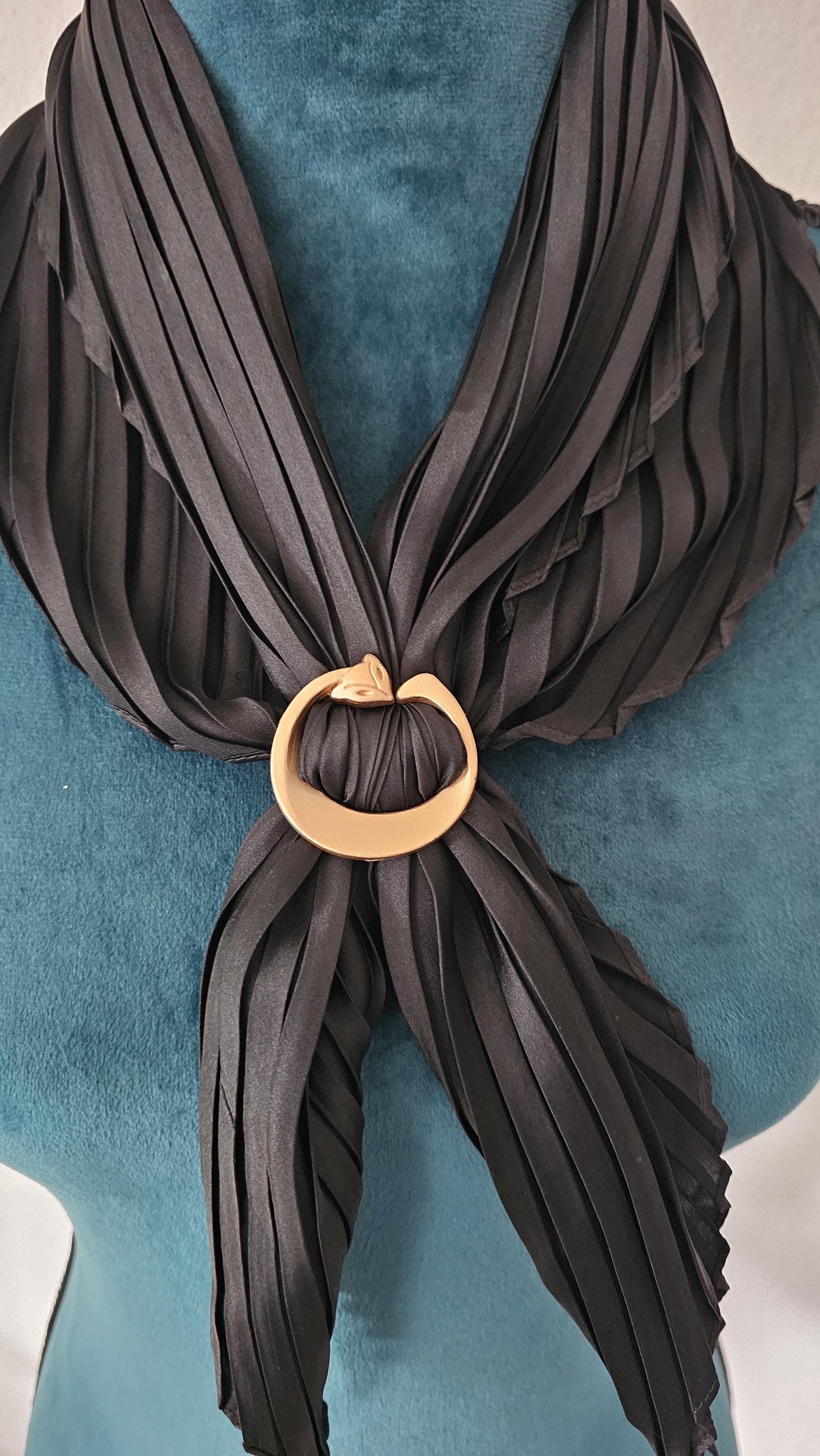 The matte gold cat scarf ring holds scarves and shawls in the perfect position and becomes an eye-catcher. Never be without them again, and they're versatile.