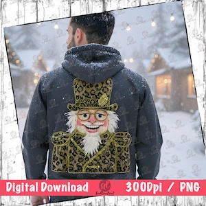 Può includere: Una felpa con cappuccio grigio scuro con un design ricamato dettagliato di uno schiaccianoci sorridente con cappello a cilindro e giacca con stampa leopardata. Il testo "Digital Download 3000DPI / PNG" è in basso.