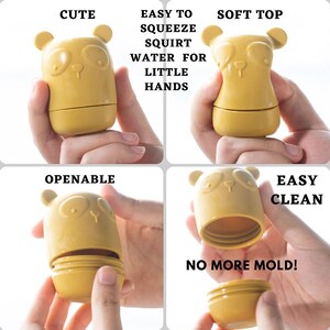 K&ouml;nnte beinhalten: Eine gelbe Plastikwasserflasche in Form eines Pandab&auml;ren. Die Flasche ist leicht zu dr&uuml;cken und hat einen weichen Deckel. Die Flasche ist auch &ouml;ffnungsf&auml;hig und leicht zu reinigen. Der Text "EASY CLEAN" und "NO MORE MOLD!" ist auf dem Bild zu sehen.